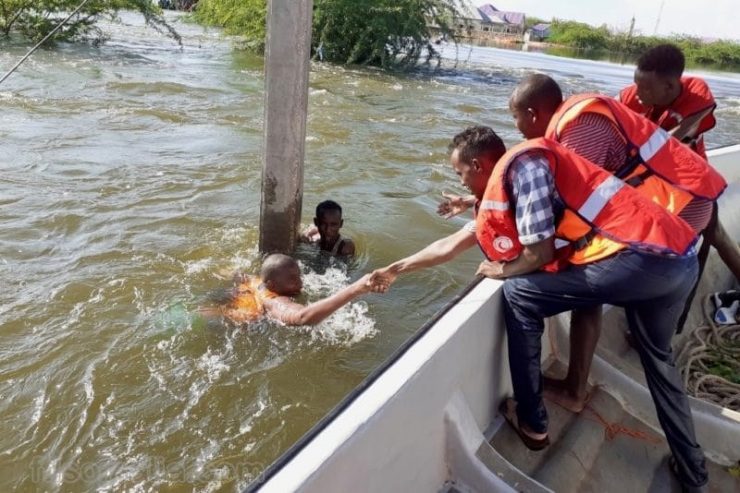 Two persons being rescued from drowning