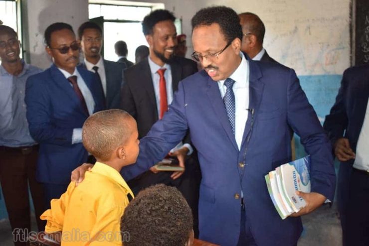 President Farmajo of Somalia providing books to school
